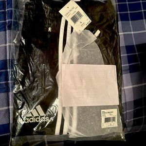 TRG black Adidas sweat pants.  Size L.  Brand new never taken out of the bag.